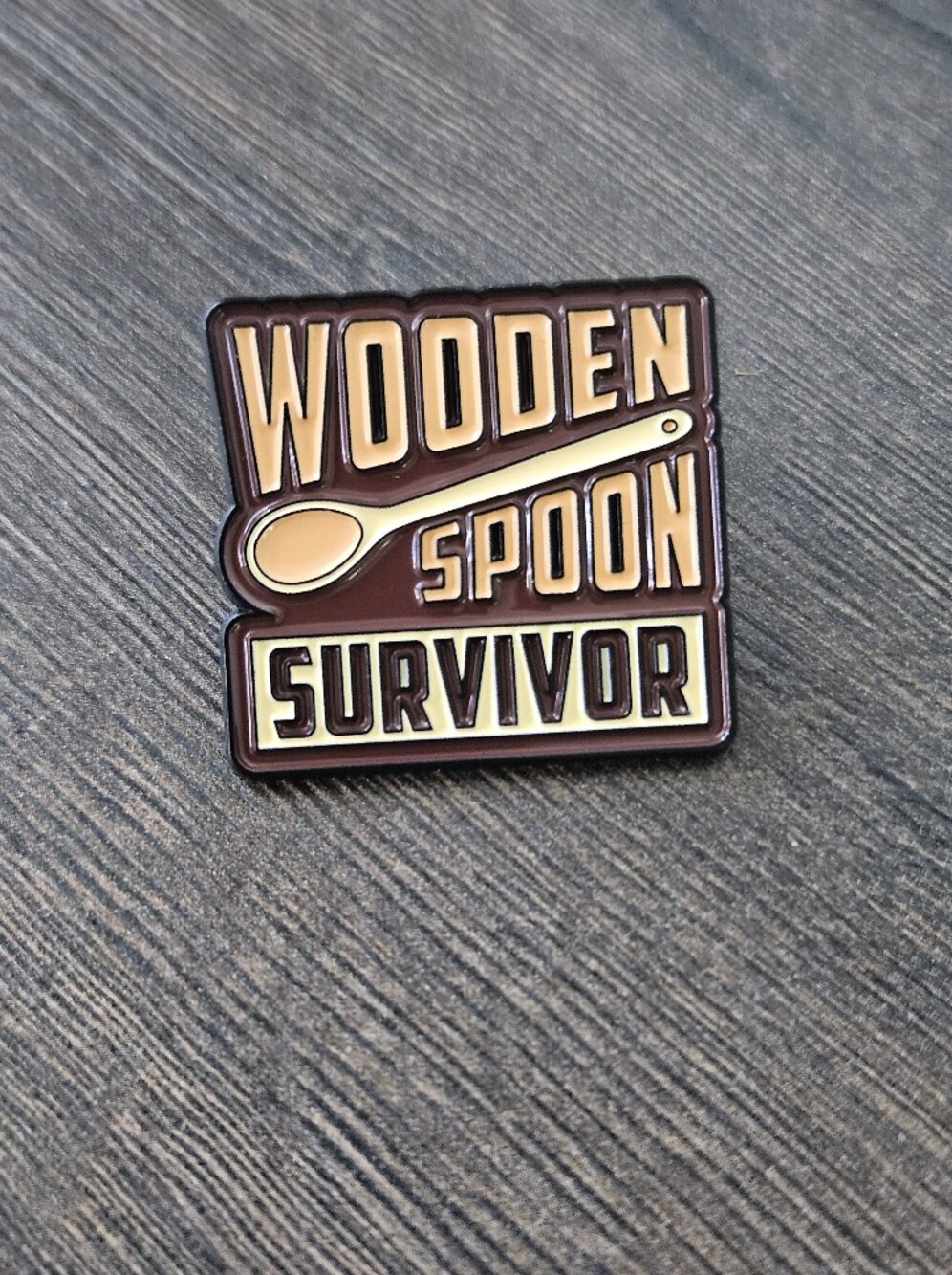 Funny “Wooden Spoon Survivor” Enamel Lapel Pin Childhood Humor New - Picture 2 of 6